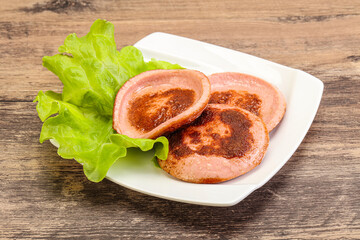 Roasted sausage slice in the plate