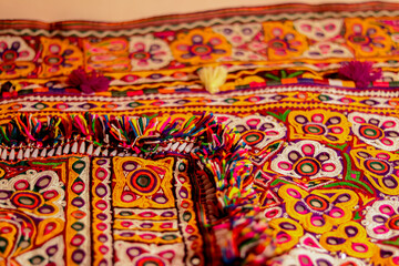 Fototapeta premium handwork embroidery,Handmade embroidery art. Traditional Indian handmade embroidery art,selective focus,mirror work colorful handmade ahir bharat,Kutch-gujarat