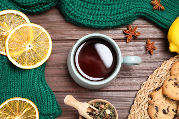 Flat lay composition with tasty tea in cup on wooden table