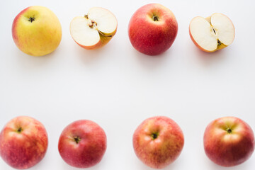 red apples on white background, halves of apples on a white background