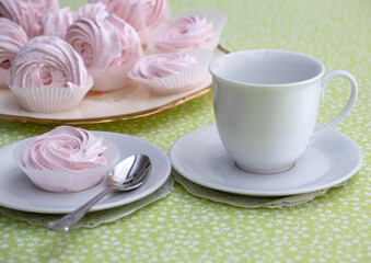 An empty white marshmallow tea mug. Selective focus.