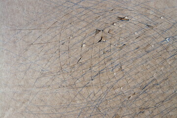 Paperboard damaged by cuts from handmade operation