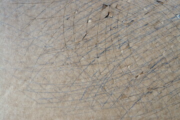 Paperboard damaged by cuts from handmade operation