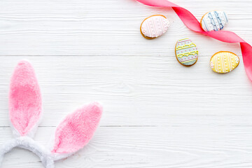 Happy Easter background. Bunny ears with eggs cookies, space for text
