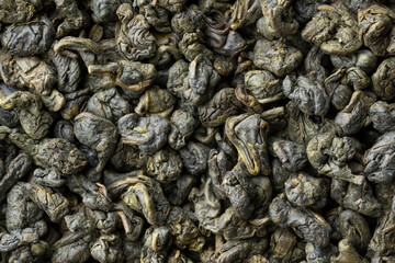 Heap of green gunpowder tea full frame close up