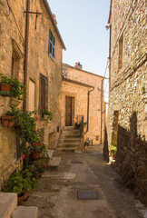 Fototapeta na wymiar A residential street in the historic medieval village of Semproniano in Grosseto Province, Tuscany, Italy 