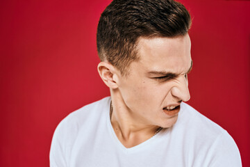 Obraz premium Man in white t-shirt emotions displeased facial expression isolated background