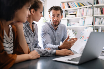 Software engineers working on project and programming in company