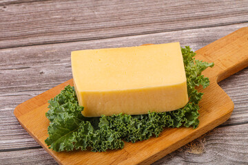 Tasty yelloow Tilsiter cheese brick