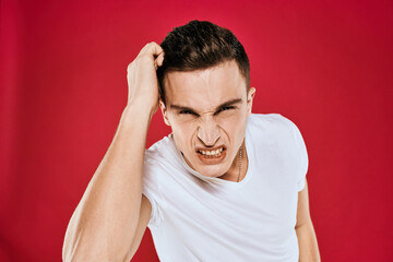 Man in white t-shirt emotions displeased facial expression isolated background
