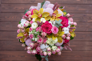 Fresh flowers are collected in a bouquet. Hat box with flowers.