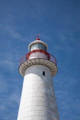 White lighthouse on bright summer day