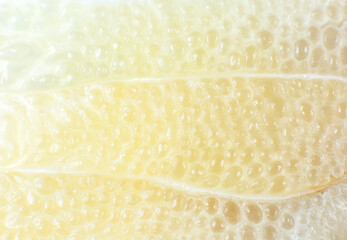 Grapefruit texture inside on the white background. Citrus close up photo. Healthy lifestyle photo. Beautiful wallpaper. Vegetarian and vegan concept. Vitamins from nature.