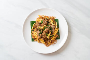 stir-fried instant noodle with pork and egg
