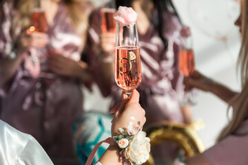 Glasses with pink champagne at a bachelorette party.