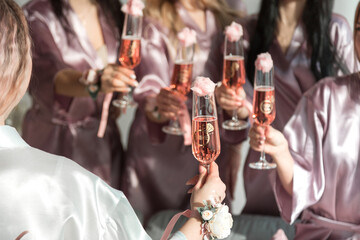 Glasses with pink champagne at a bachelorette party.