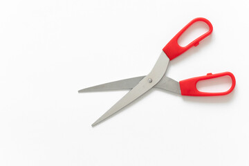 red scissors on isolated white background with place for text