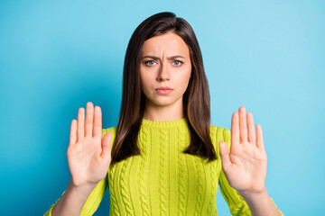 Portrait of young beautiful upset negative serious girl woman female hold hands showing no gesture...