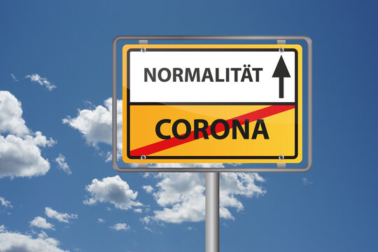 Corona Virus Pandemie vorbei, endlich wieder Normalität - Ortsausgangsschild vor blauem Himmel