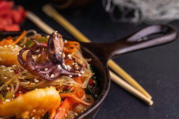 Seafood noodles. Asian stir fry noodles with seafood and vegetables.