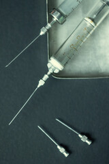 Old reusable glass syringes with needles