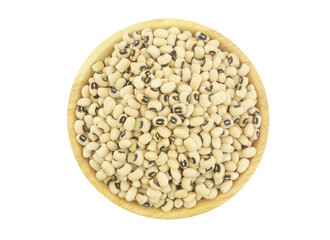 Black eyed beans in wooden bowl isolated on white, top view