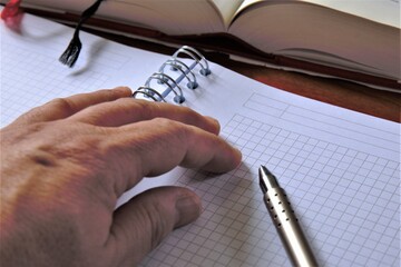 writing on a notebook
