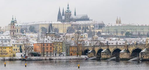 Historical center of Prague covered in the first snow of the winter.