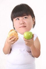 Big head the fat woman is holding junk food in her hand and enjoy eating diet of healthy concept