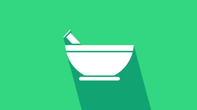 White Mortar and pestle icon isolated on green background. 4K Video motion graphic animation.