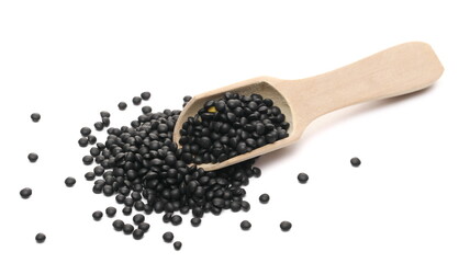 Black beluga lentils pile with wooden spoon isolated on white background