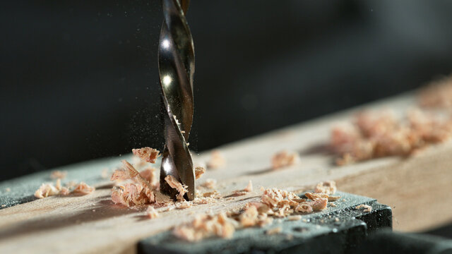 Detail Of Drill Making Hole Into Plywood