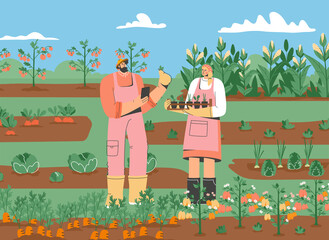 Couple of farmers standing in vegetable garden