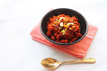Gajar Halwa. Indian carrot pudding. It's a sweet dessert made from carrots, sugar, and cream. Garnished with cashew, almond, Raisin, and pistachio.