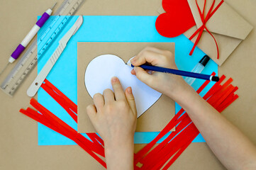 Craft for Valentine's Day. Making a heart using the quilling method. Step-by-step instructions for...