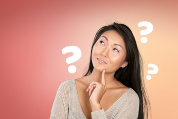 Question sign with a beautiful alarmed woman on pastel background