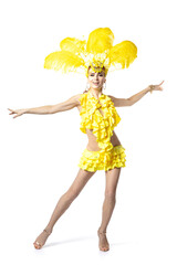 Graceful. Beautiful young woman in carnival, stylish masquerade costume with feathers dancing on white studio background. Concept of holidays celebration, festive time, dance, party, having fun.
