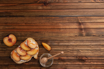 in the left corner of the table sandwich with peach and cheese