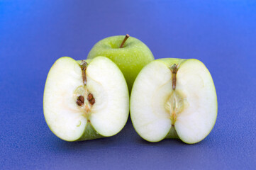 green apple on blue background