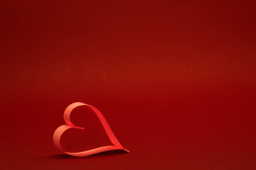 Heart of paper on a red background