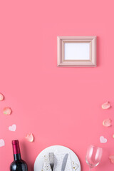 Plate with gift and rose petals for Valentine's Day special meal concept.