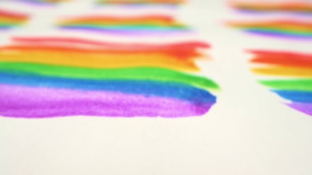backdrop. extremely close-up, detailed. background of rainbows painted with watercolor on a sheet of paper.