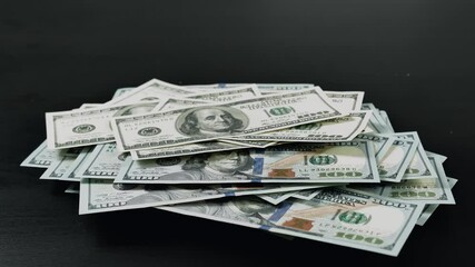 Timelapse of counting money. Hundred american dollars falls on the table. Money making concept
