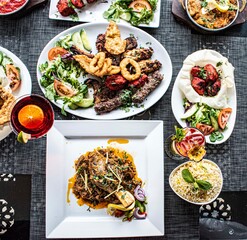Indian food  platter   kebabs  salad   curry  on a platter 
