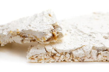 Meringue cake sprinkled with nuts cake isolated on white background