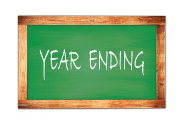 YEAR  ENDING text written on green school board.