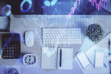 Multi exposure of forex graph drawing over desktop background with computer. Concept of financial...