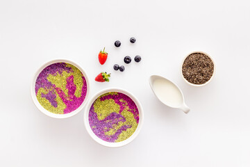 Smoothie bowles with chia seeds and strawberries, top view
