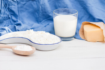 Assortment of dairy milk prodacts cheese, milk, creame, cottage cheese. Nature organic products concept.
