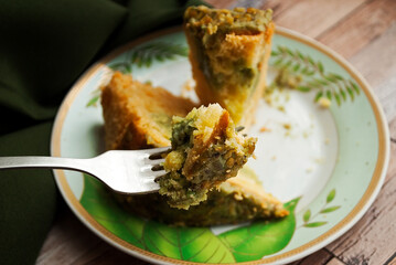 Pistachio cake. Someone has a cake. Gluten free baked goods.